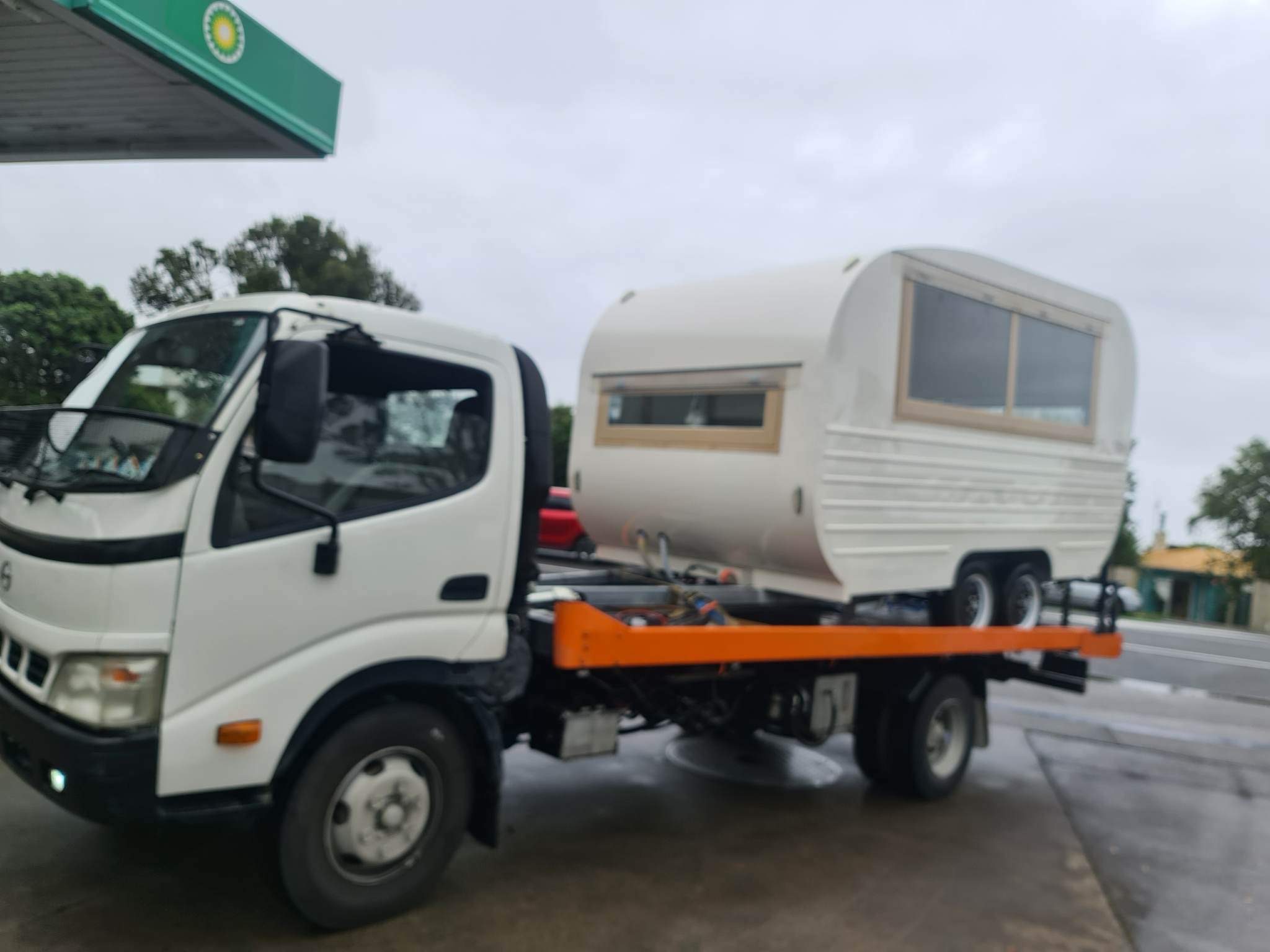 Fast Towing tow truck transporting a caravan in Auckland